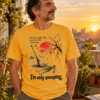 im-only-sweeping-japanese-ink-art-tshirt-ap21 I'm Only Sweeping AP21 graphic T-shirt featuring a Japanese ink-style broom, human-shaped dust silhouette, red sun, cherry blossoms and musical notes on a cream background.